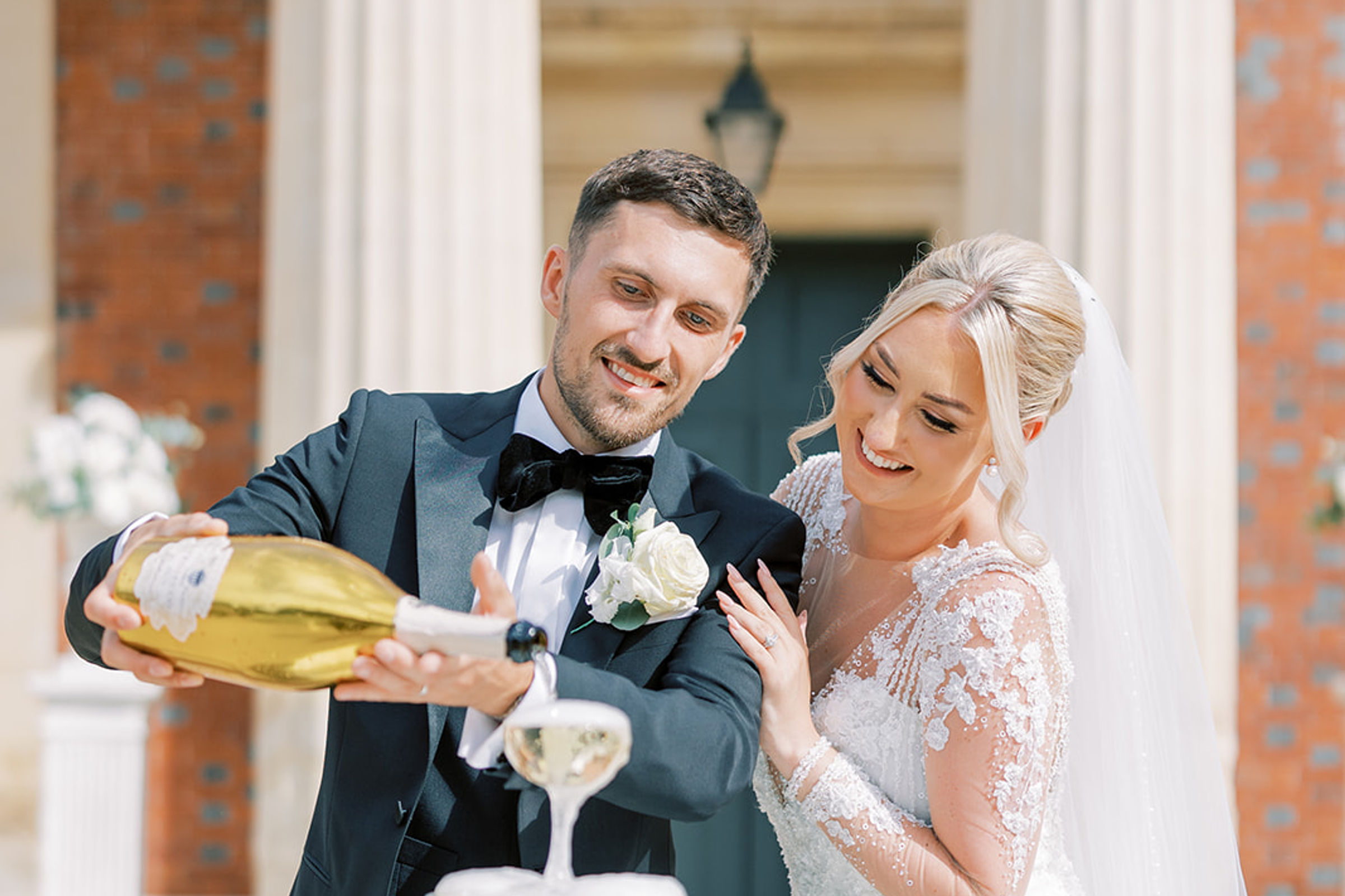 The couple pouring the champagne tower